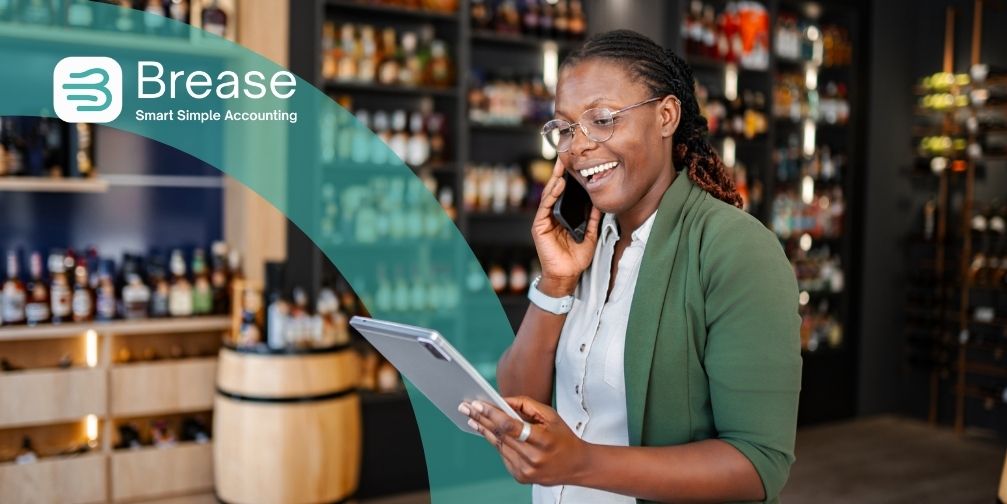 Sole trader checking her records as HMRC prepares MTD sign-ups